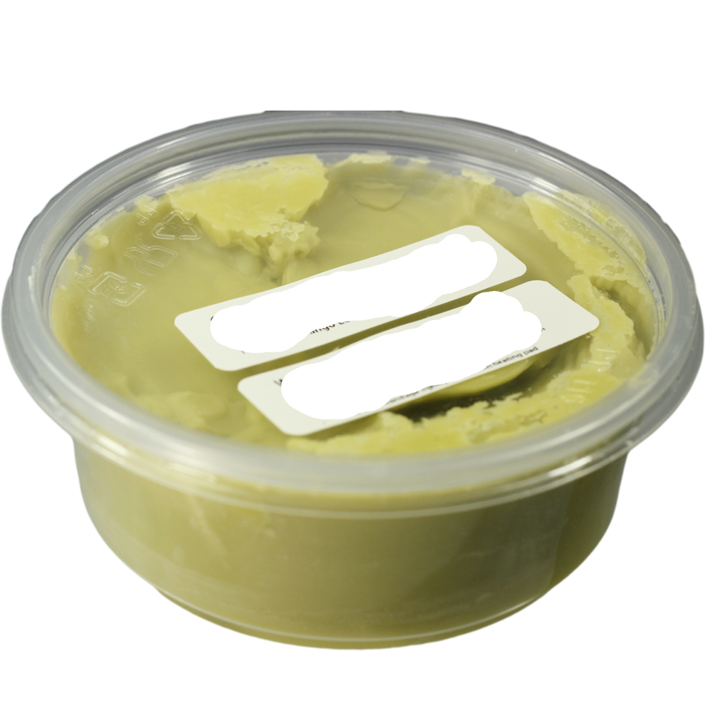 A plastic bulk container of hand and body cream labeled 'Sore Muscle Freeze with Magnesium (Dead Sea Salt)